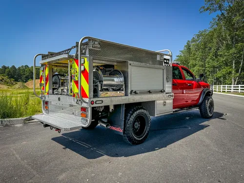Right-side profile view with side body compartments and rear wheel.